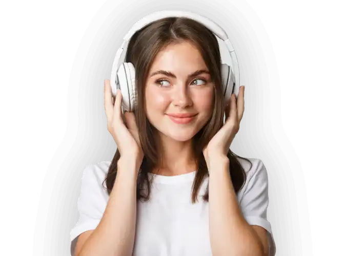 A girl wearing headphones with her hands on her ears.