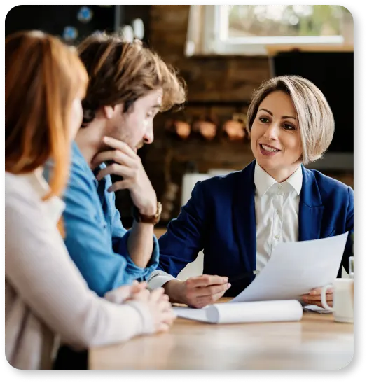 Three people sitting at a table discussing their online presence.